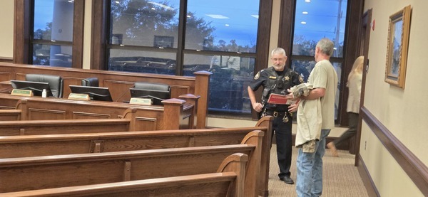 Deputy, Steve Schreck, County Manager exiting